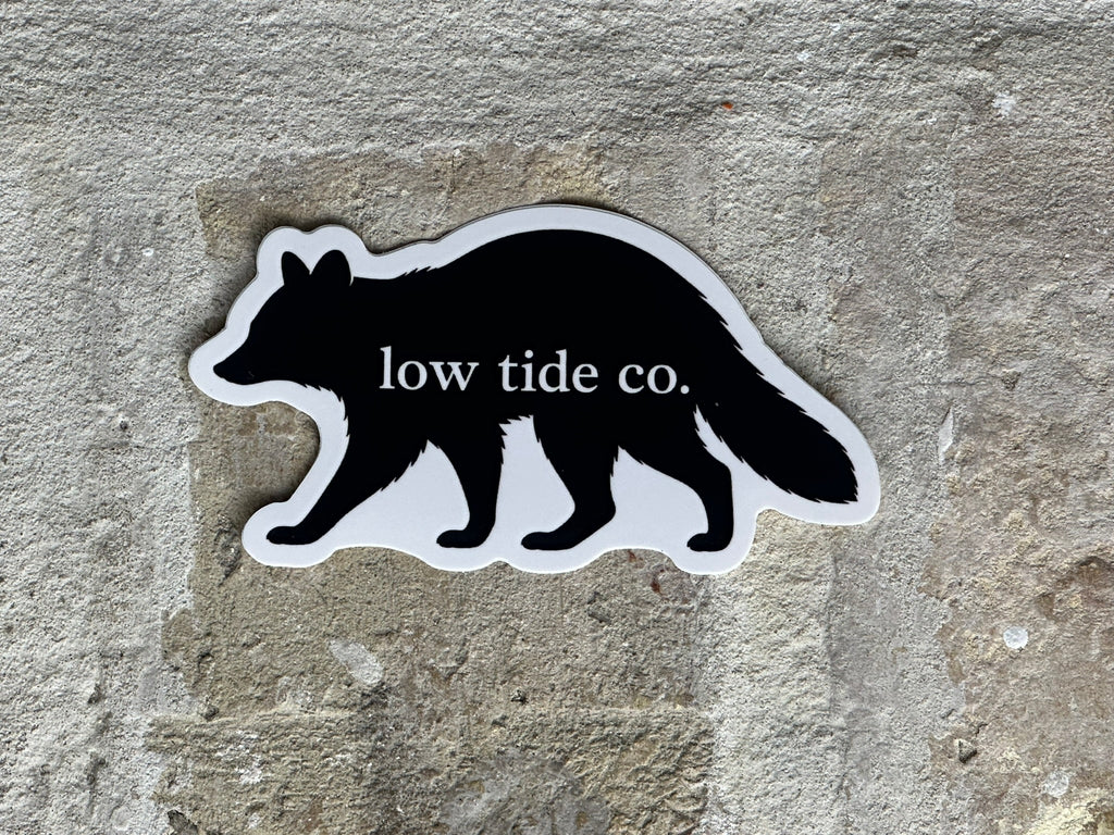 Huck — Low Tide Raccoon Sticker