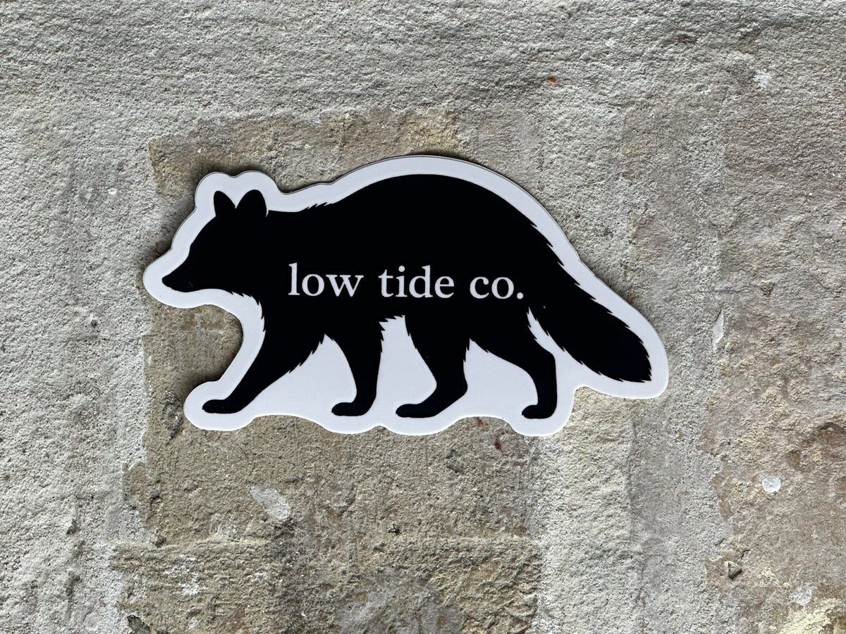 Huck — Low Tide Raccoon Sticker